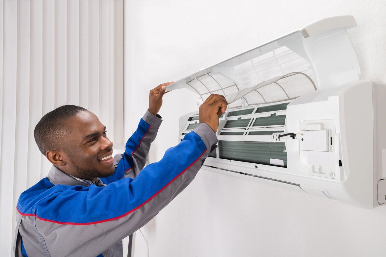 Technician Checking Air Conditioner At Home